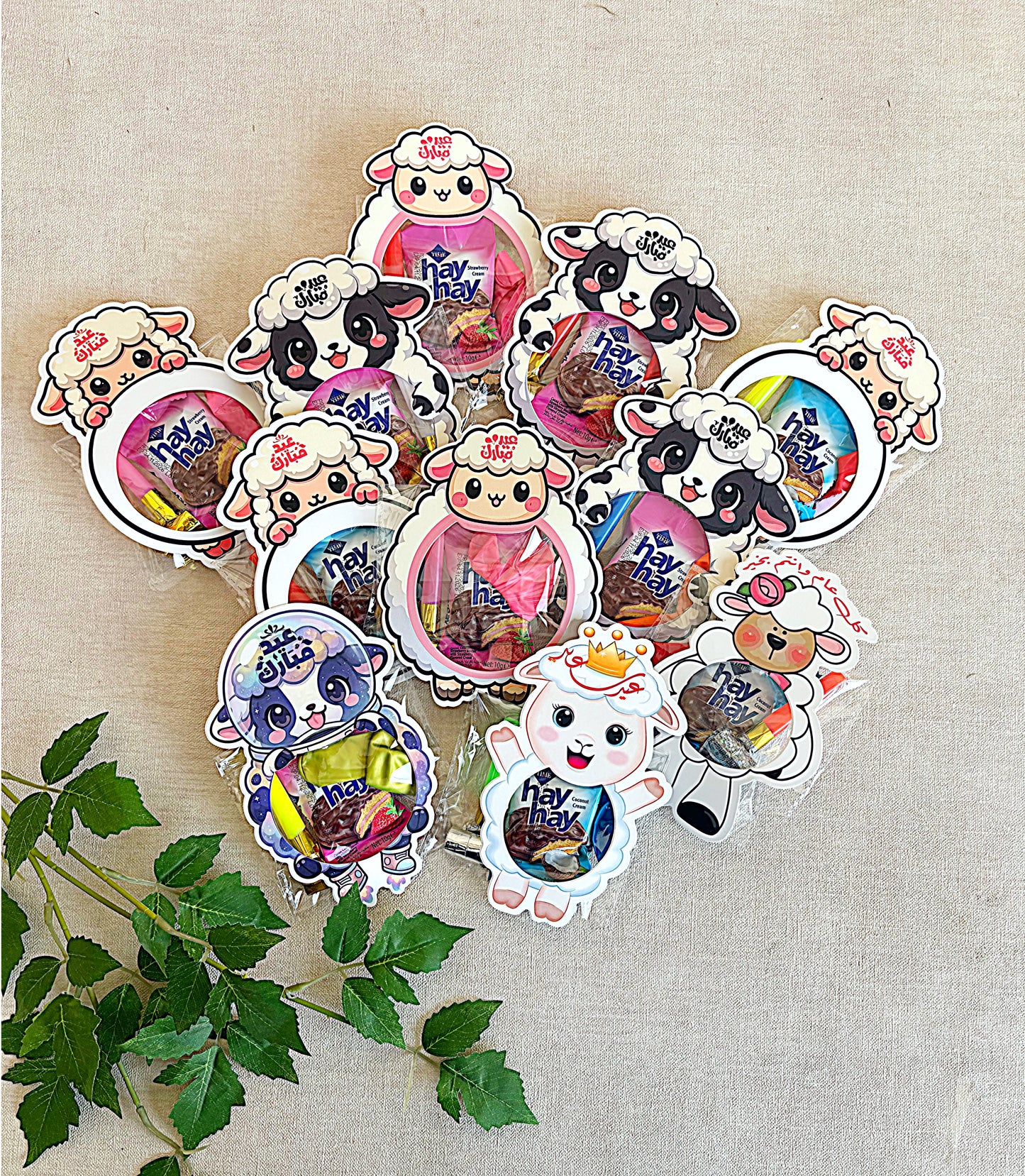Collection of colorful animal-themed stickers on a textured beige background with green leaves.