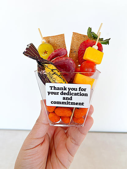 Corporate appreciation snack cup with cheese, fruit and chocolate