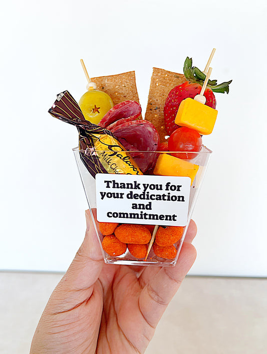Corporate appreciation snack cup with cheese, fruit and chocolate