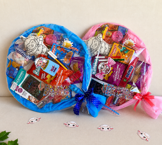 Two circular candy bouquets, one blue and one pink, filled with various candies on a beige background.
